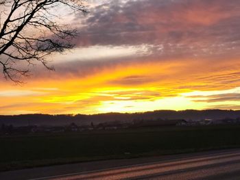 Scenic view of silhouette landscape against romantic sky at sunset