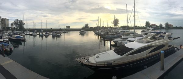 Boats moored at harbor