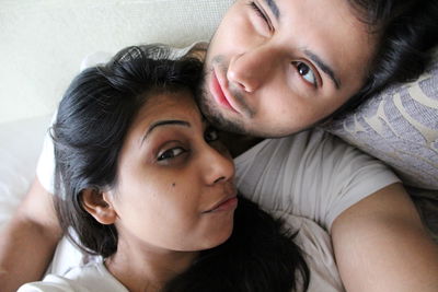 Portrait of beautiful woman lying down