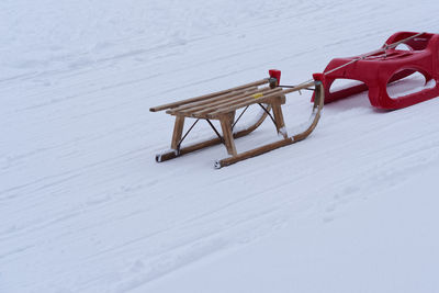 Two toboggan sleds in a winter