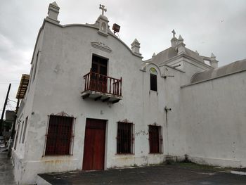 Low angle view of old building against sky