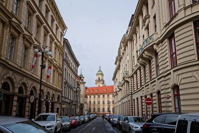 City street amidst buildings against sky