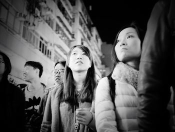 Young women dancing at music concert