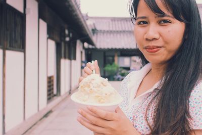 Woman holding ice cream cone