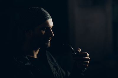 Portrait of young man looking away