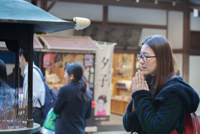 Woman praying at temple