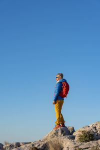 A woman hiking in the high country, el divino mountain, costa blanca