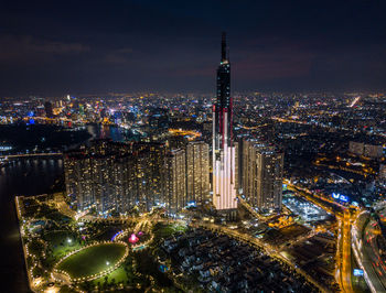 High angle view of illuminated modern buildings in city at night