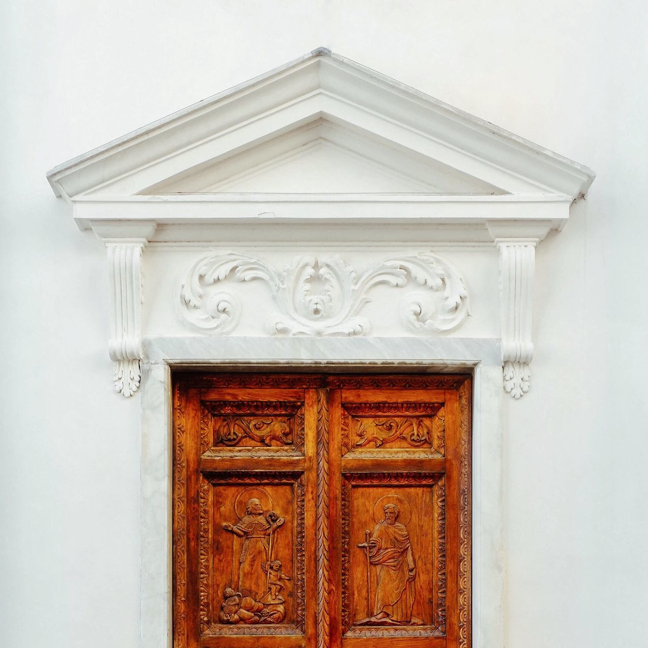 door, closed, built structure, architecture, wood - material, building exterior, ornate, close-up, design, wooden, entrance, wall - building feature, wood, pattern, old, wall, no people, safety, carving - craft product, art and craft