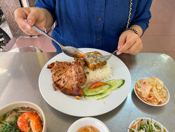 Midsection of man preparing food