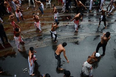 High angle view of men on water