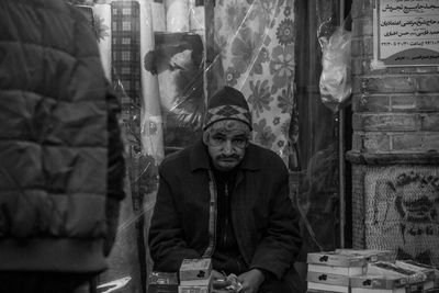 Portrait of man sitting in store