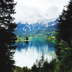 Scenic view of lake and mountains against sky