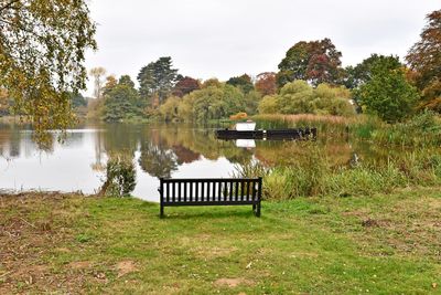 Gazebo by lake against sky