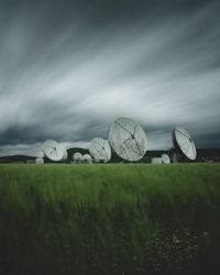 Scenic view of farm against sky