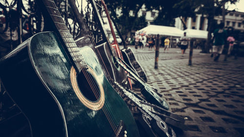 Close-up of seats on street in city