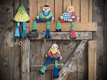 High angle view of girls with toy standing on wood