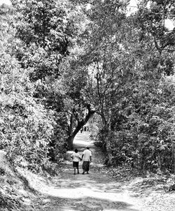 People walking on dirt road