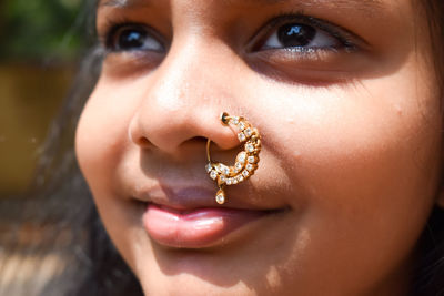 Close-up portrait of girl wearing nose ring