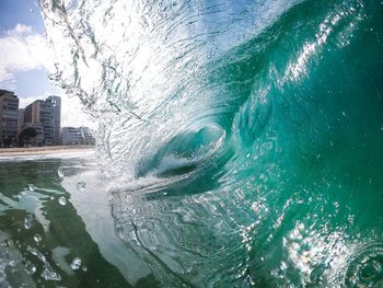 Aerial view of sea and buildings in city