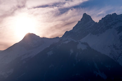 Scenic view of mountains against sky during sunset