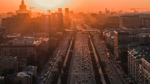 High angle view of railroad tracks amidst buildings in city