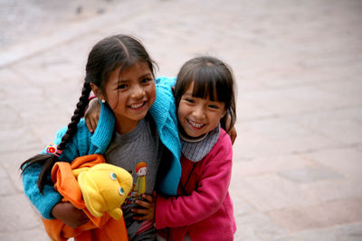 Portrait of a smiling girl standing outdoors