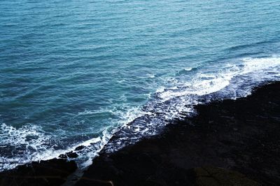 Close-up of sea against blue sky