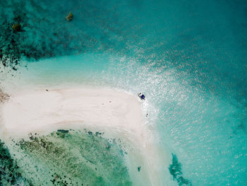 High angle view of people swimming in sea