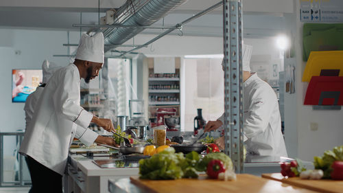 Chefs working in commercial kitchen