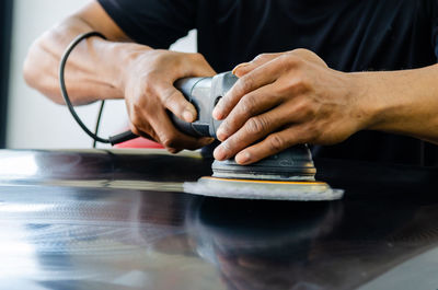 Close-up of man working on table
