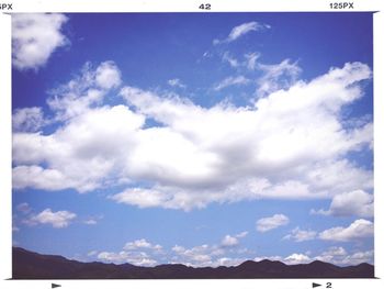 Scenic view of landscape against cloudy sky