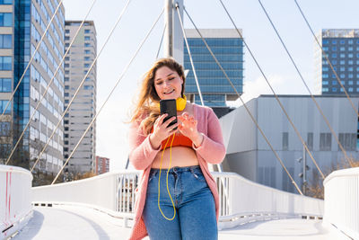 Young woman using smart phone