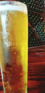 Close-up of beer glass on table