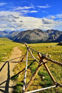 Scenic view of landscape against cloudy sky