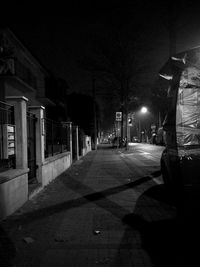 Man in illuminated city at night