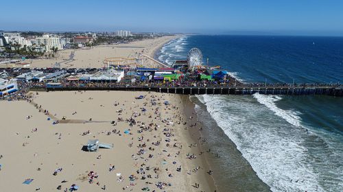 High angle view of crowd at beach against sky