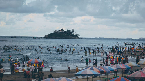 High angle view of people on beach against sky