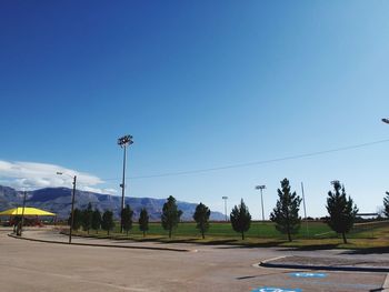 Scenic view of mountains against clear blue sky