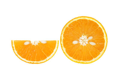 Close-up of orange slice against white background