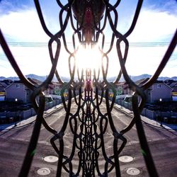 Close-up of metal structure against sky