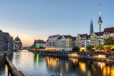 The nikolaiviertel, the river spree and the cathedral in berlin at twilight