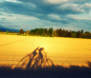 People standing on landscape against sky