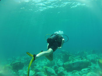 Scuba diver swimming in sea