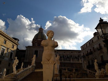 Low angle view of statue against sky