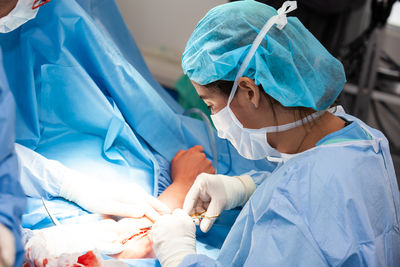 Female doctor performing a surgery. insurance concept.traumatology and orthopedics concept.