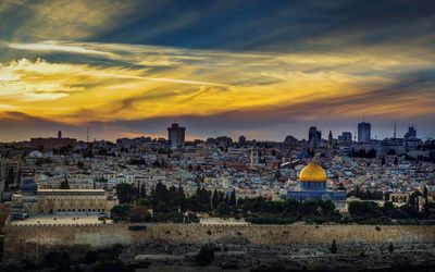 Cityscape against sky during sunset