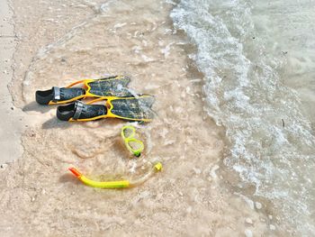 High angle view of shoes on beach