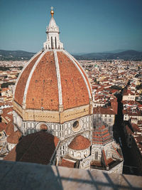 Aerial view of city and buildings against sky