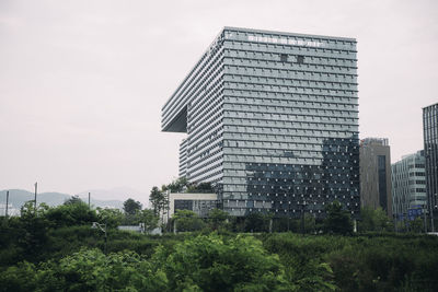 Low angle view of modern buildings against sky